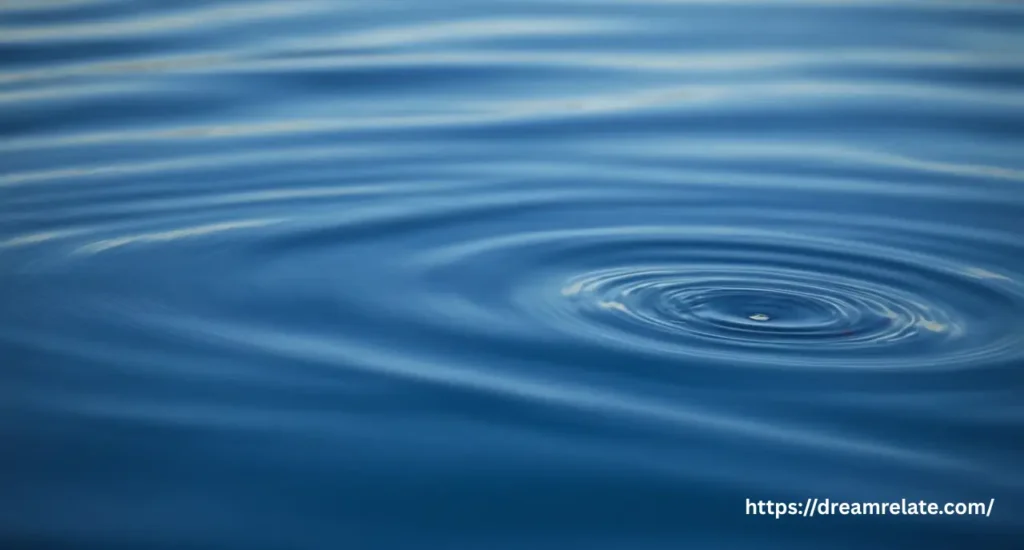 A symbolic image representing a dream about drowning, with light filtering through deep blue water.